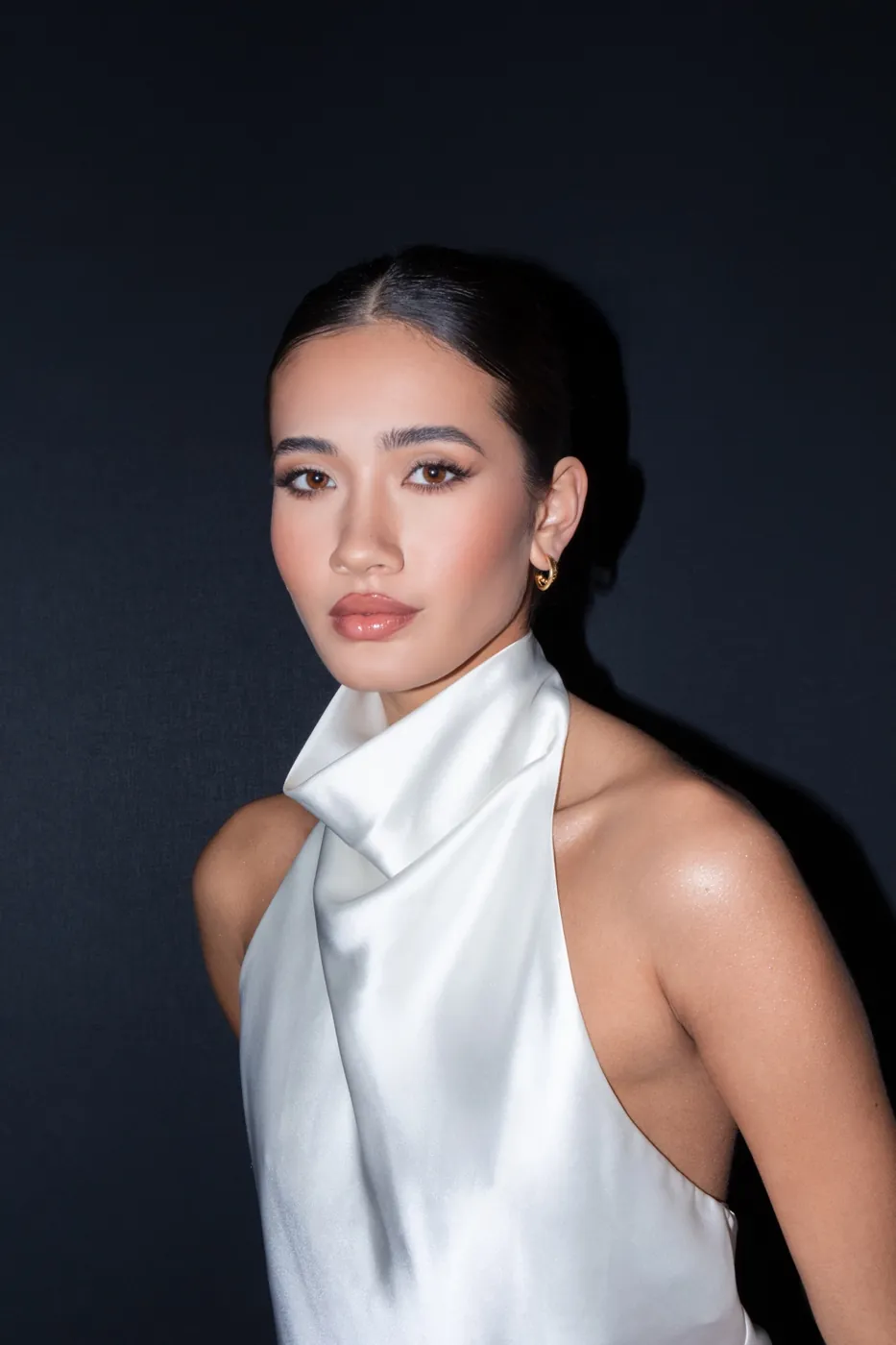 Sculpted skin with a satin halter neck