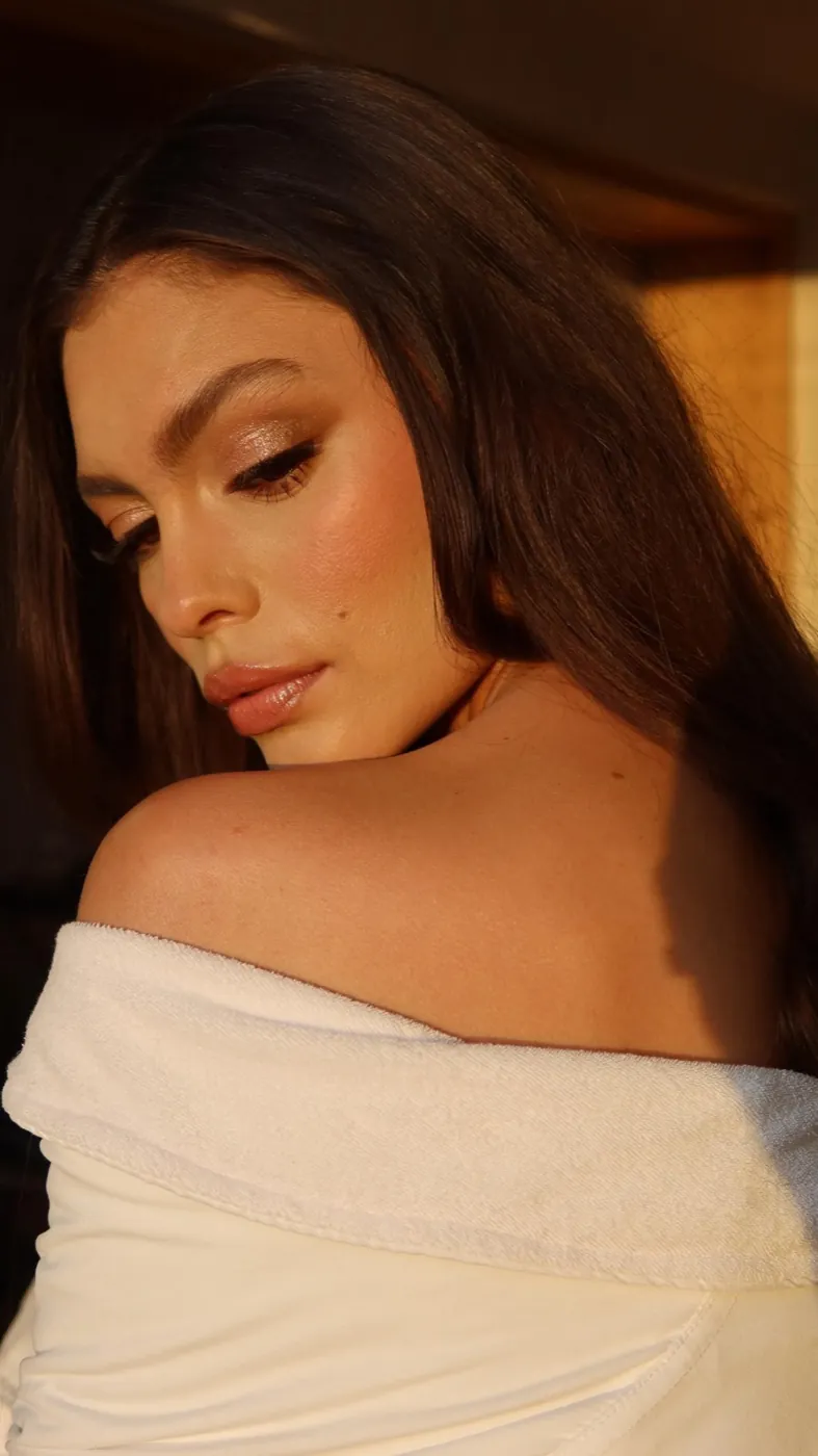 Over-the-shoulder bronzed glow in golden light